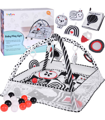 Kontrastne harjumisvaip koos värviliste pallide ja raamatuhelinaga